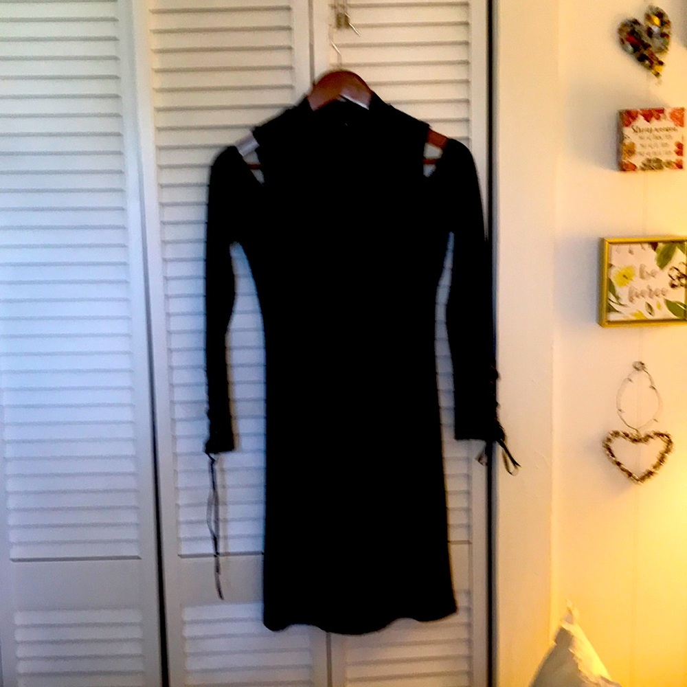 Black party dress. Beautiful details with open shoulders.